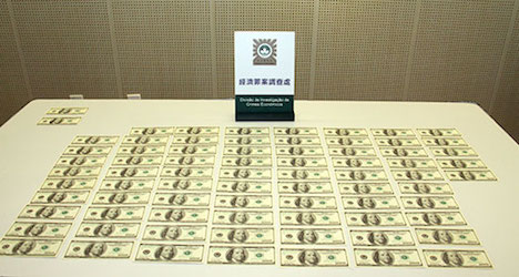 押収された偽100米ドル札（写真：マカオ司法警察局）