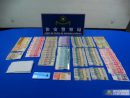 被疑者の所持品及び座席下などから見つかった各種通貨の現金(写真:マカオ治安警察局)